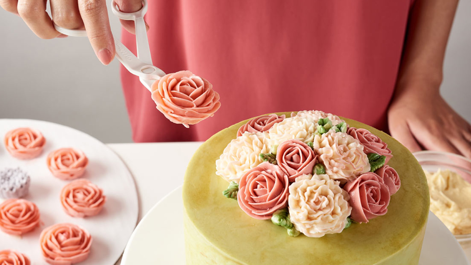 Decorating a cake with buttercream flowers
