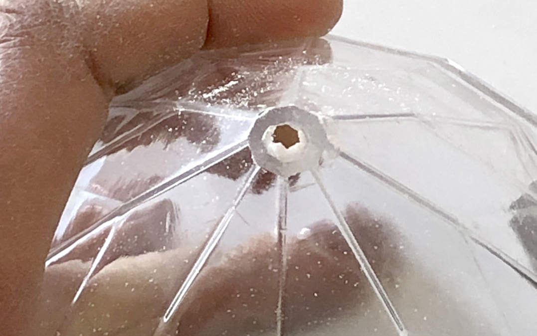 Hole in the top of a clear pyramid