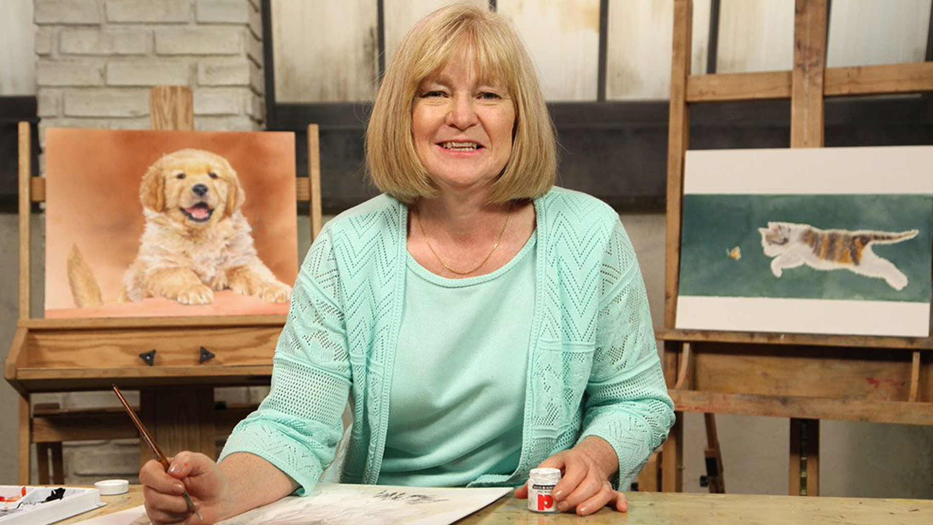 Woman painting animal portraits