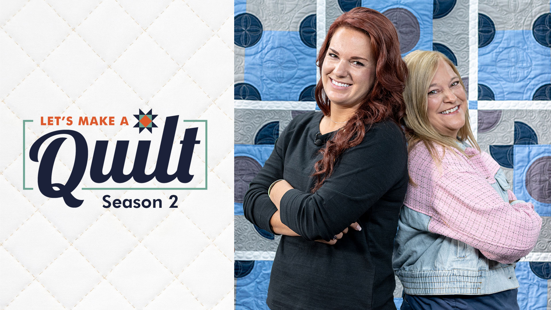 Two women posing back to back in front of a quilt