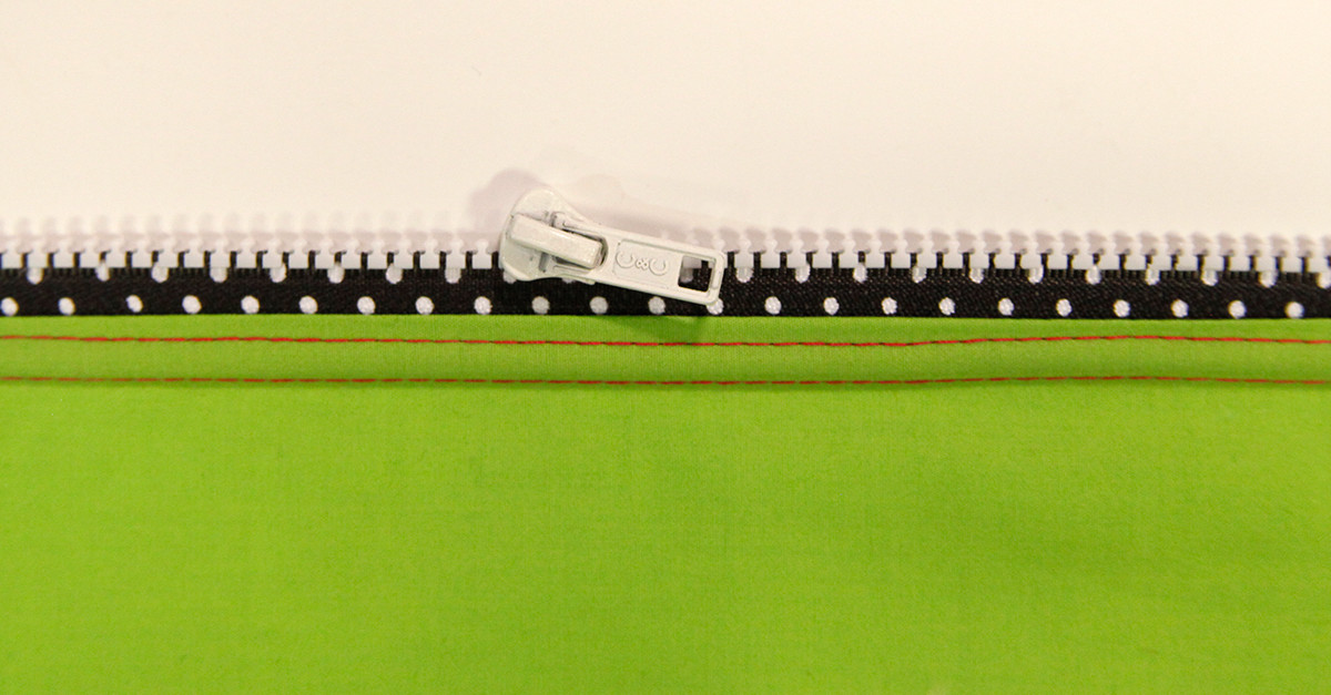 White zipper on black polka dot and lime green project