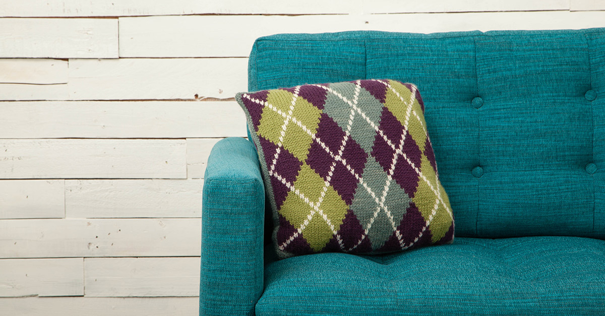 Intersia pillow on a couch