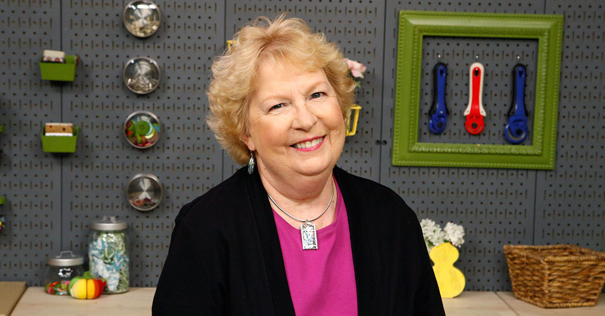 Headshot of a woman with short blonde hair