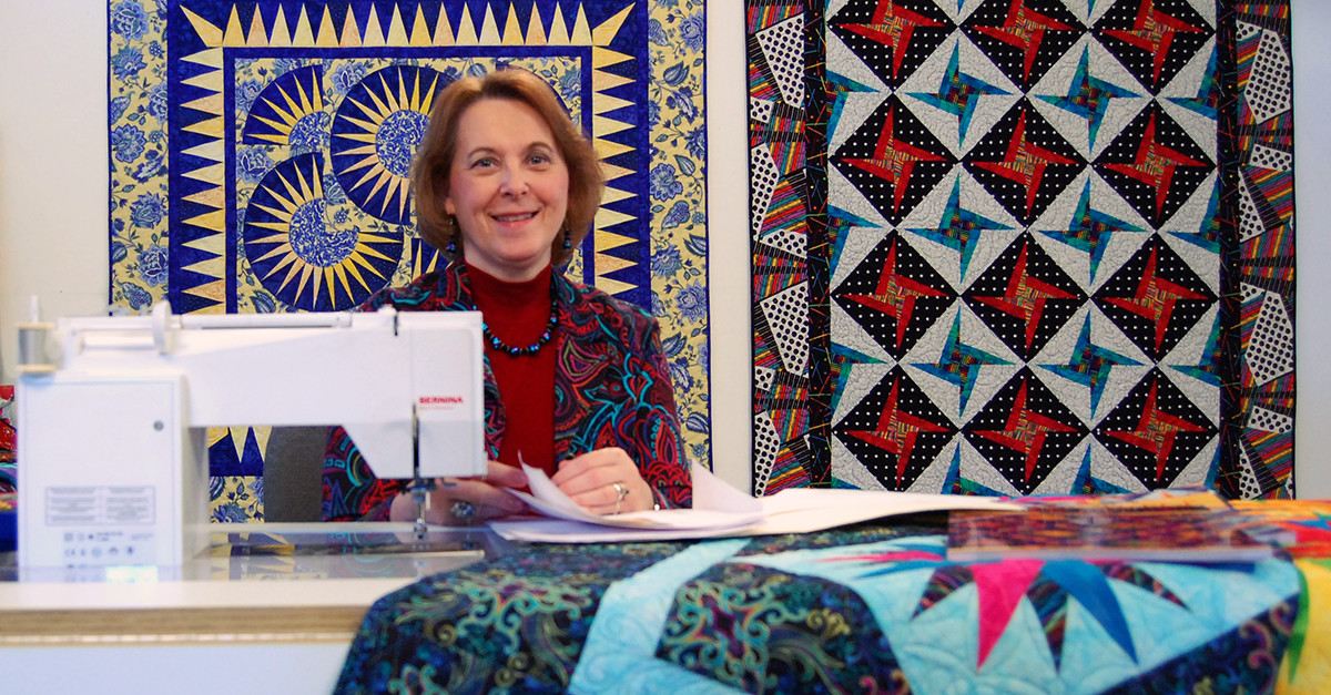 Woman sewing a quilt