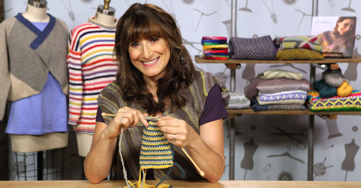 Woman knitting a striped project