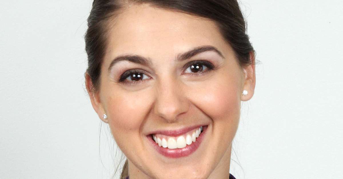 Headshot of a woman with brown hair
