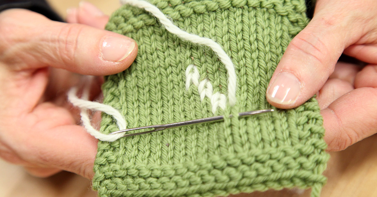 Intarsia project with green and white yarn